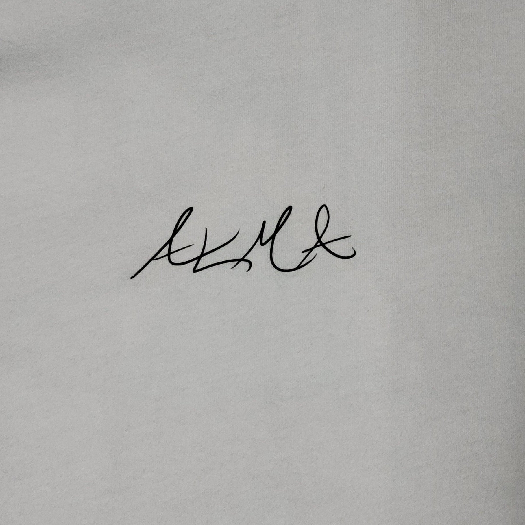 White t-shirt with black branding on a white background