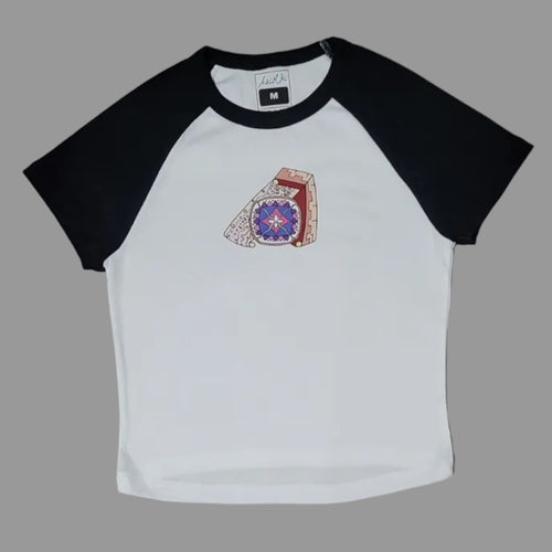 White t-shirt with black sleeves and a logo on a beige surface